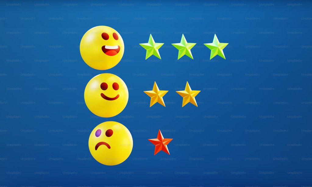 Three rows showing emoticons and stars: the top row has a happy emoticon with a wide smile and three green stars; the middle row has a neutral, slightly smiling emoticon and three yellow stars; the bottom row has a sad, frowning emoticon and one red star. This represents customer satisfaction or review ratings.