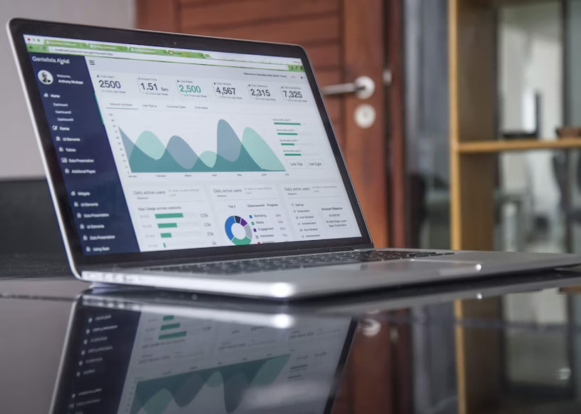 A laptop screen displaying a web analytics dashboard with various graphs and data points, illustrating the measurable impact of powerful SEO tools.