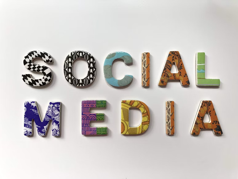 Colorful, patterned block letters spelling out "SOCIAL MEDIA" on a white background.