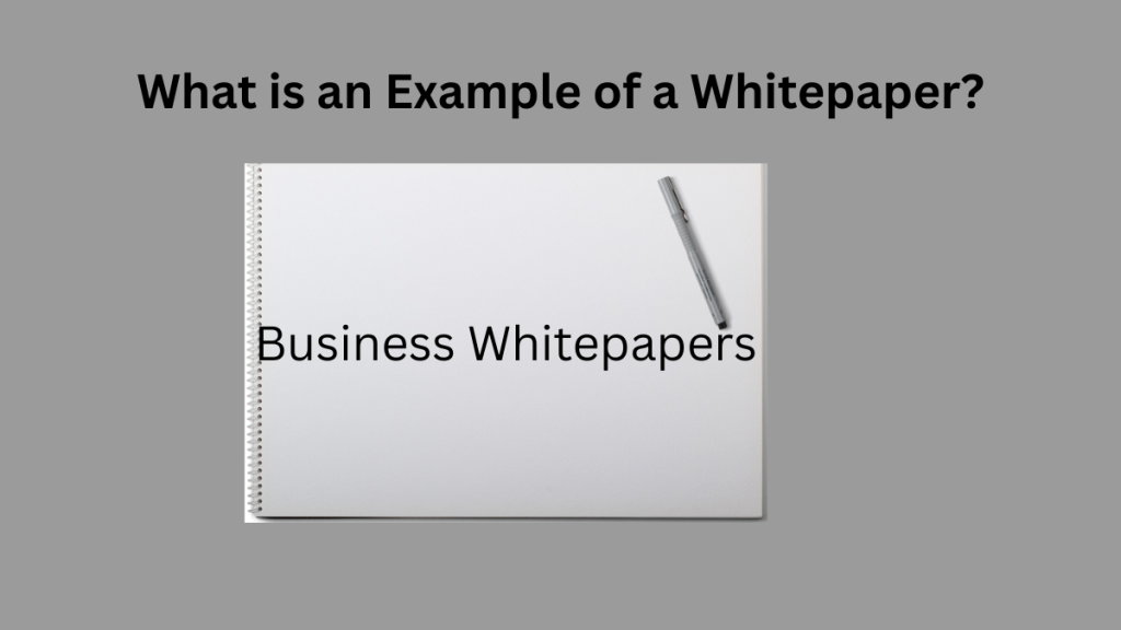 A blank white spiral notebook with a pen, labeled "Business Whitepapers," directly addressing the question of what is an example of a whitepaper.
